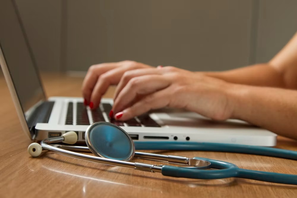 Doctor measuring blood pressure in clinic